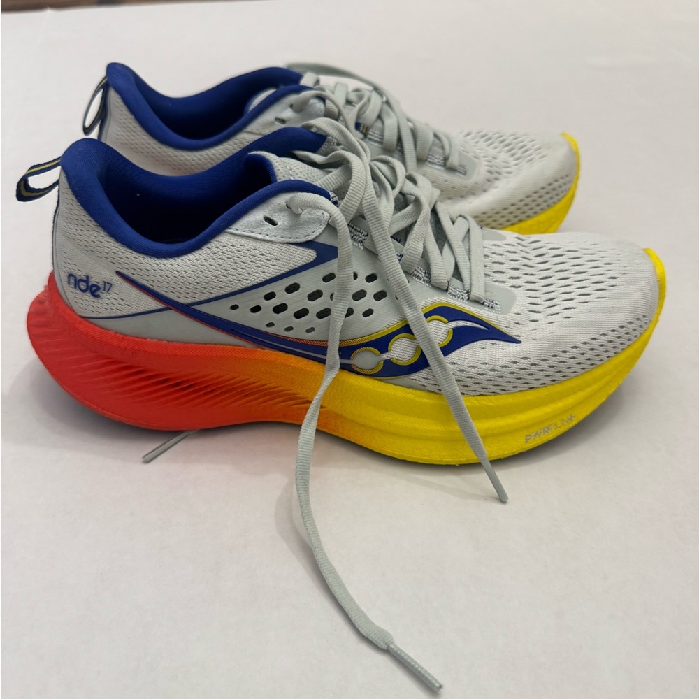 Saucony White and Yellow Running Shoes with Blue and Orange Accents